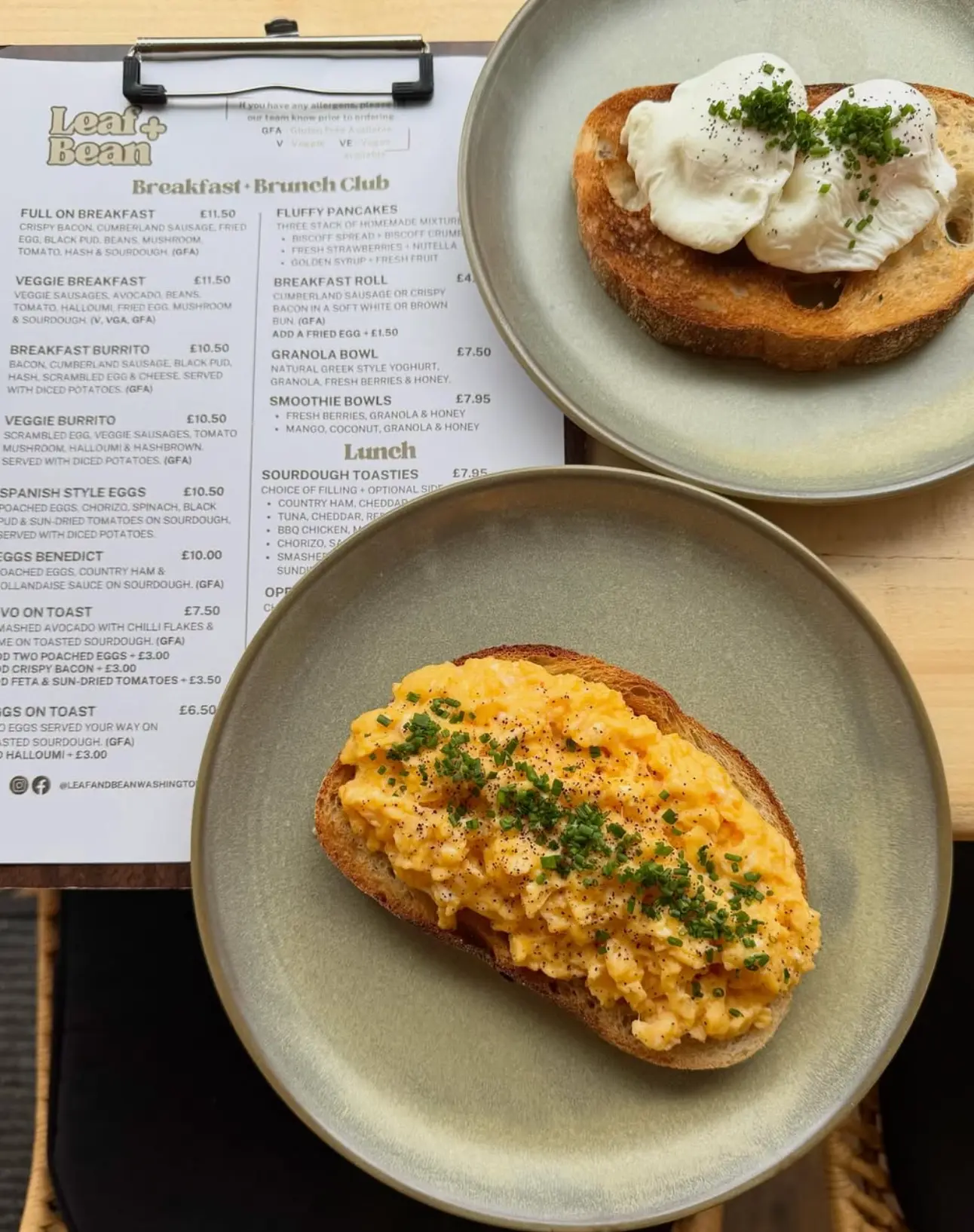 Poached eggs and scrambled eggs on toasted sourdough with the Leaf + Bean breakfast menu board