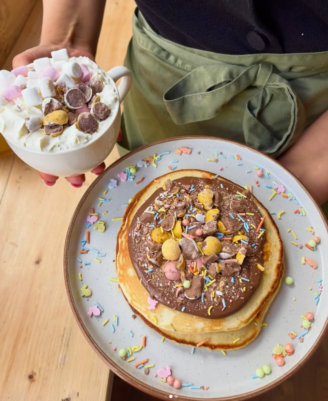 Leaf + Bean Easter special of pancakes topped with chocolate mini eggs and a loaded hot chocolate